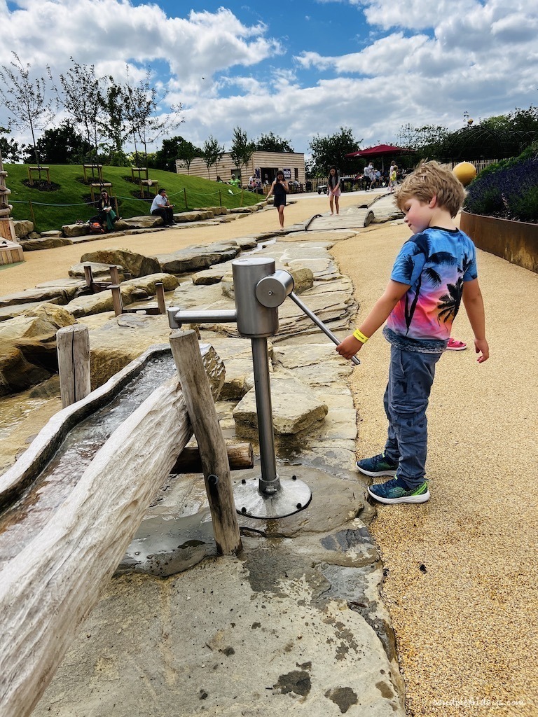 Harry playing with the water in the main area of the new play area at Blenheim