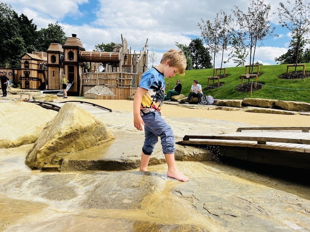 Harry playing with the water in the main area of the new play area at Blenheim