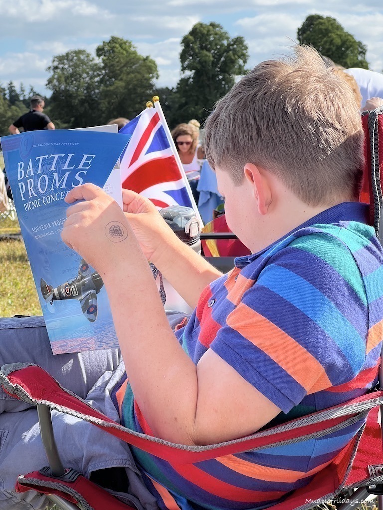 Charlie reading the programme for Battle Proms while we wait for the show to start