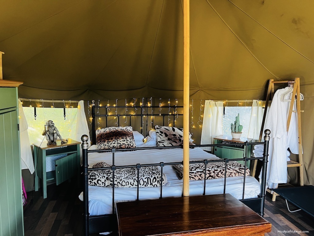 king sized bed in the safari tent at Watercess Lodges and campsite in Ropley