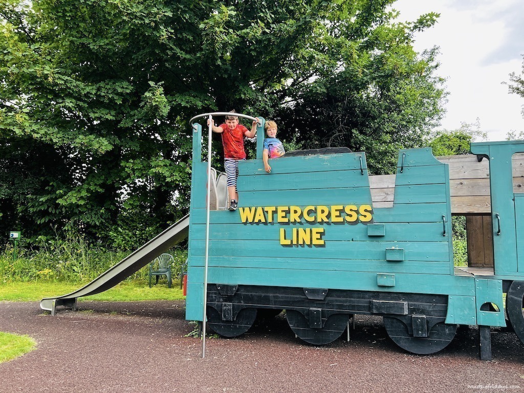 The boys playing the train themed play area at the Ropley train station on the watercress line