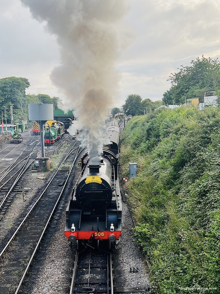 Steam engine going under the harry potter bridge in Hampshire