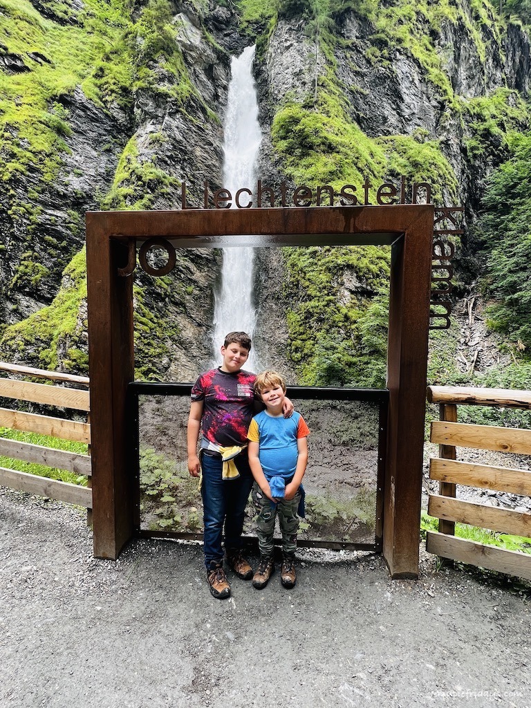 The boys in front of the photo opportunity at liechtensteinklamm