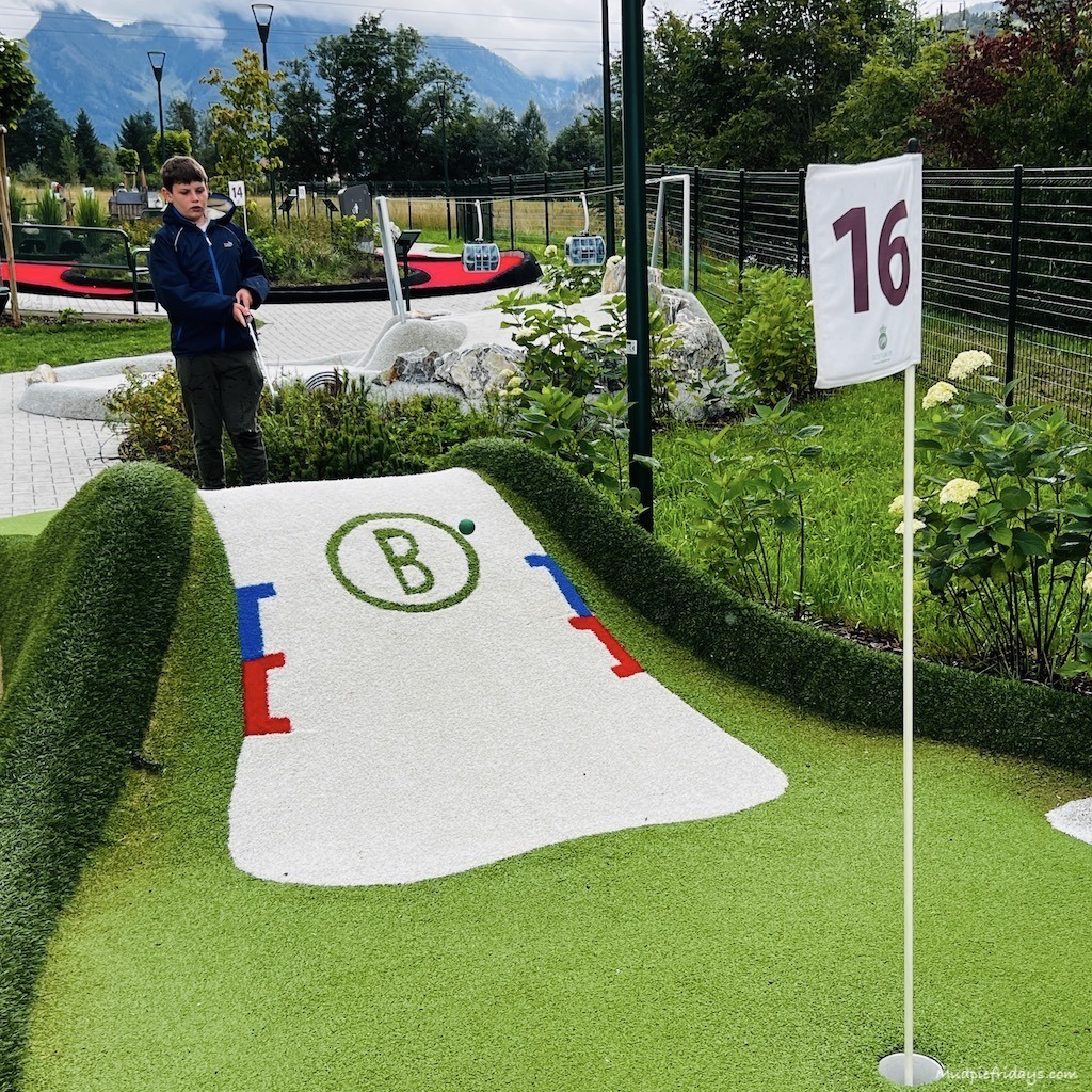 Charlie playing minigolf