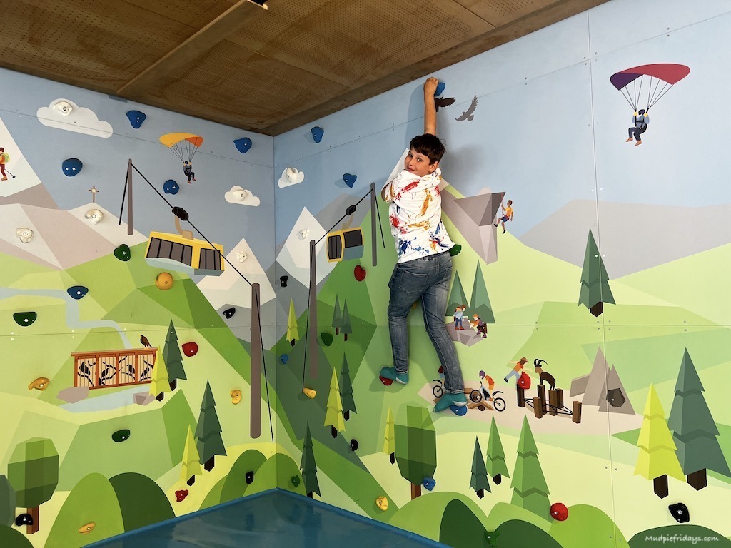 Charlie trying out the climbing wall at the inside Ravensburger play area up the top of Ahorn, Mayrhofen, Zillertal Austria