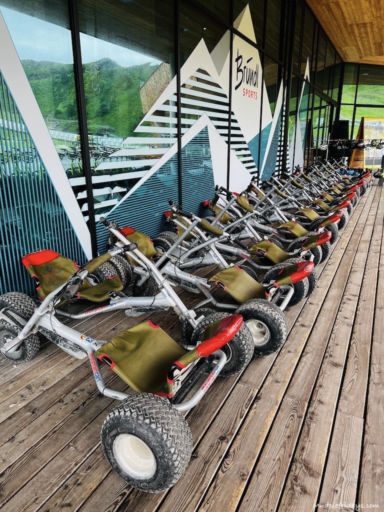 Go-karts waiting for their next trip out on guided tours at the top of the The nepal bridge which is a paid for activity at the Spieljoch Family Adventure Mountain