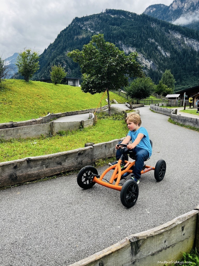 Harry racing a go-kart at Erlebnis Sennerei Cheese Factory Mayrhofen