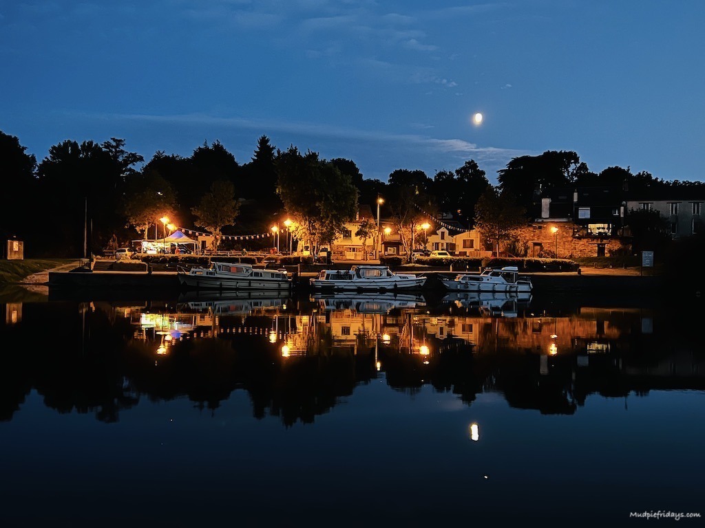 The boats reflecting on the water during our canal boat hire holiday france