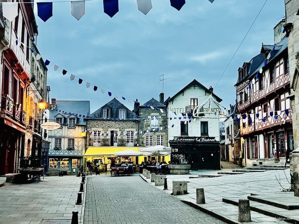Place de la Republique in Josselin with the flags and square