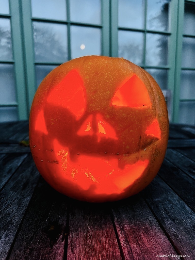 Halloween pumpkin carved on wooden table
