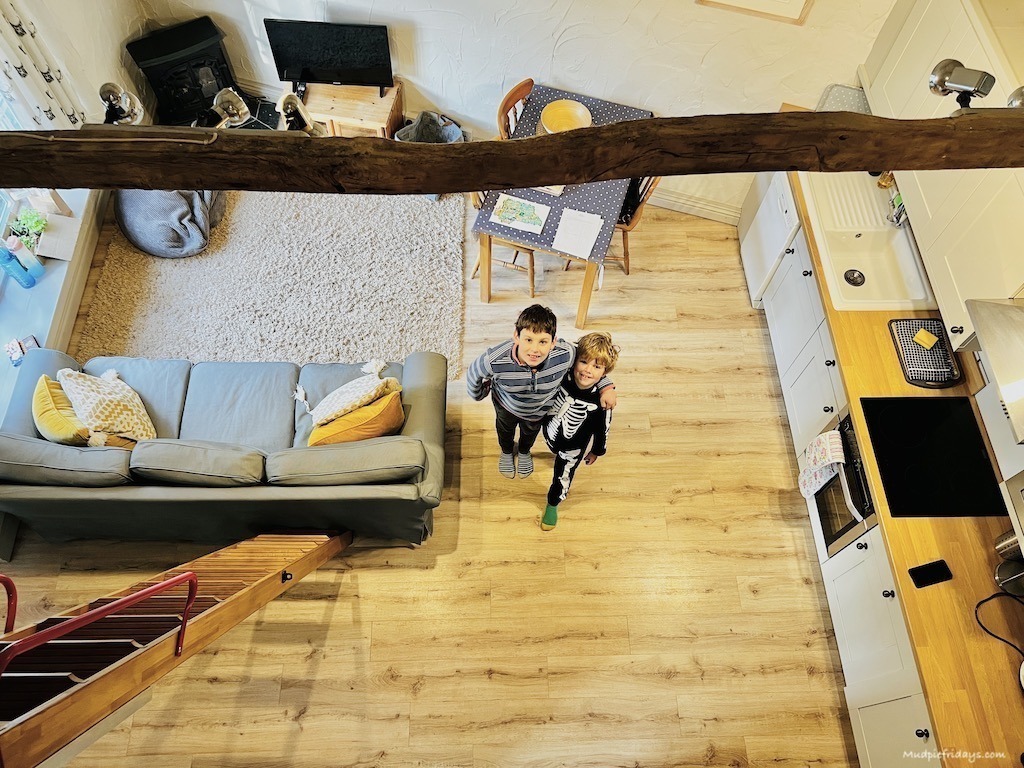 The boys standing in the living area while I stand on the mezzanine