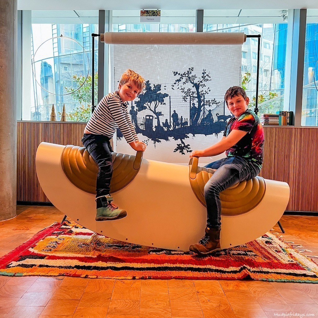 The boys on an inside seesaw on the mezzanine area