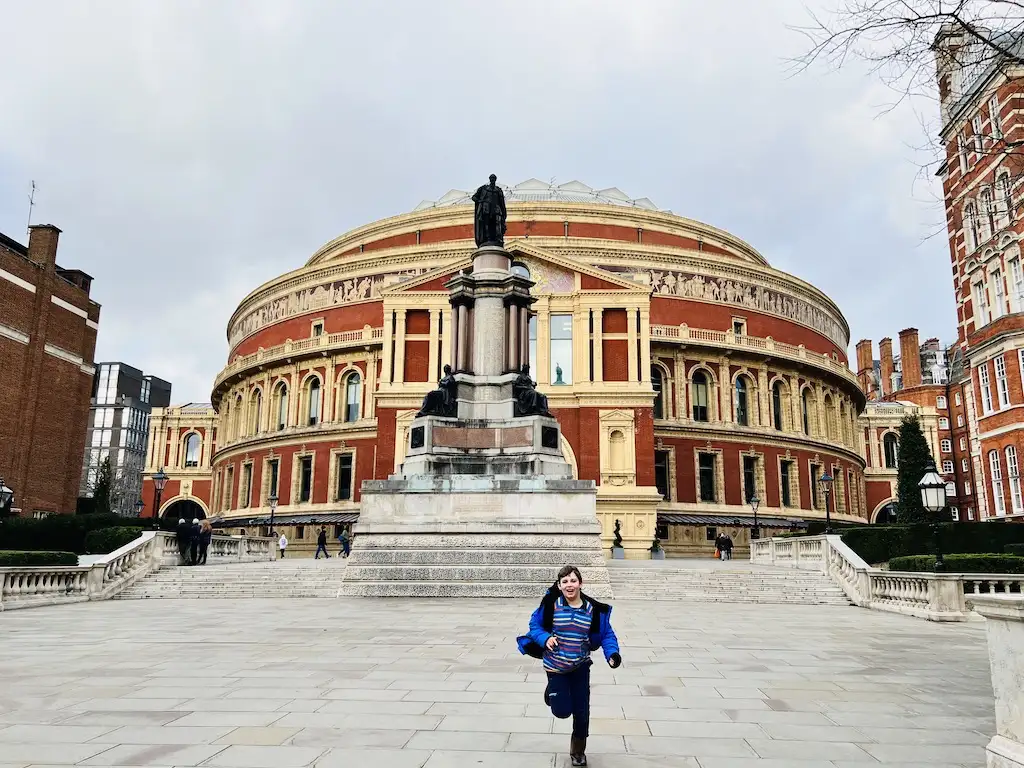 Charlie running outside the Royal Albert Hall - family Christmas shows london 2023