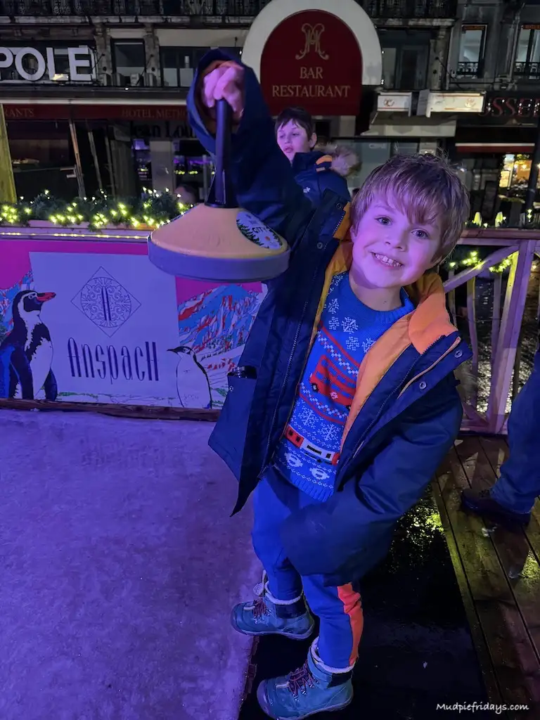 Harry holding a curling stone when we played on the ice