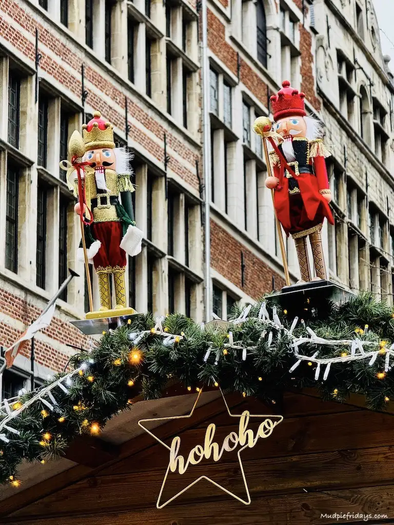 Two nut crackers on the top of a wooden chalet at the Antwerp Christmas Market