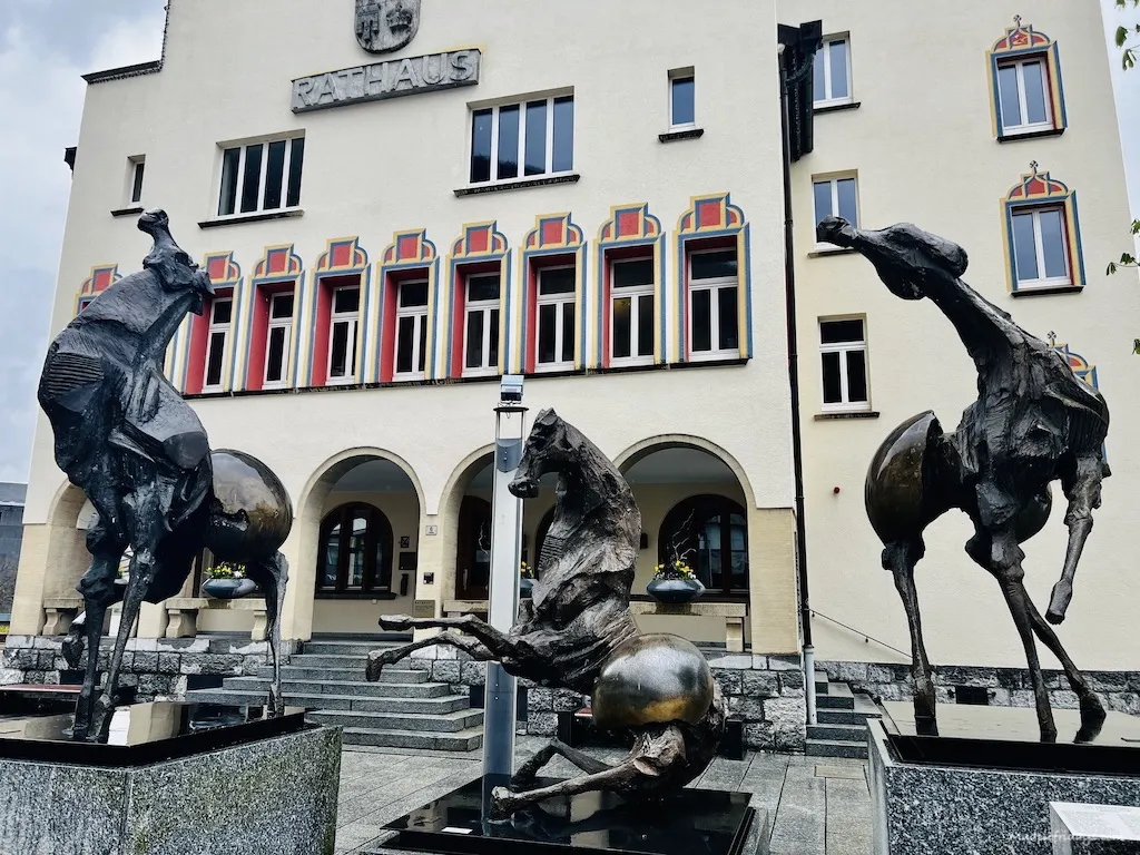 town hall and outside it the Tre Cavalli by Nag Arnoldi statue in Vaduz Liechtenstein