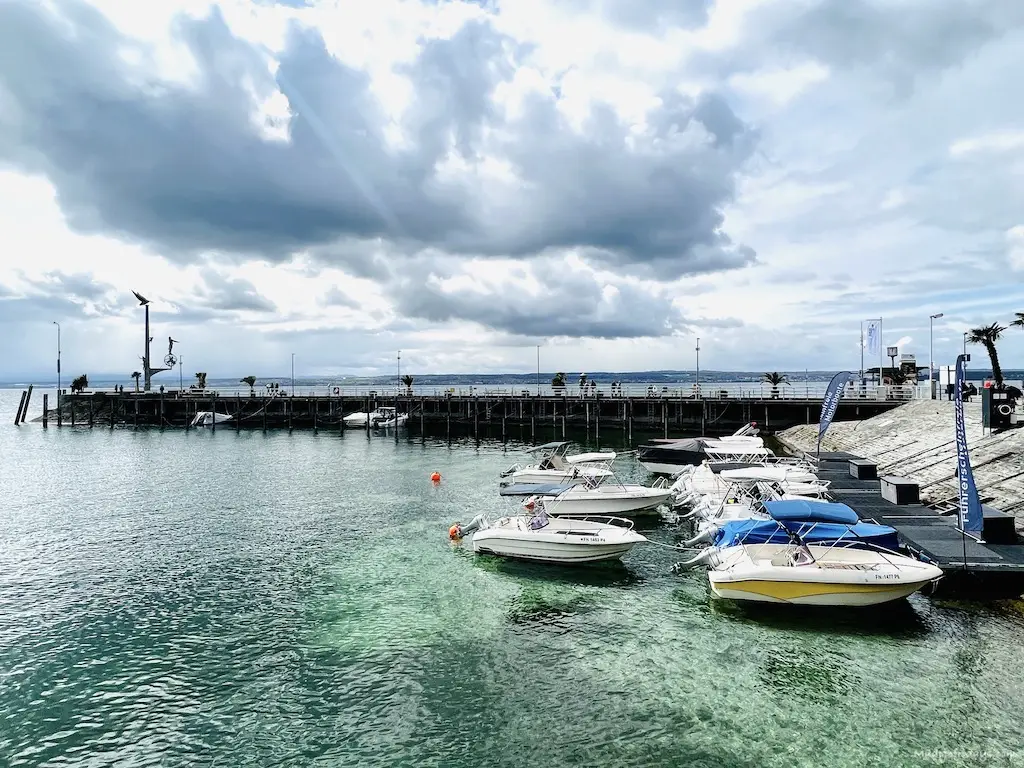 The small harbour area of Meersburg on Lake Constance with little boats in the turquoise water