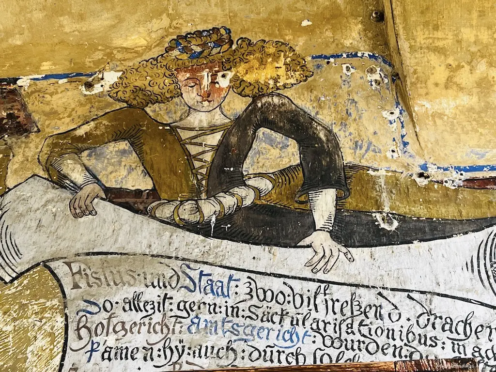 Old painting above one of the door ways in the oldest castle in Germany