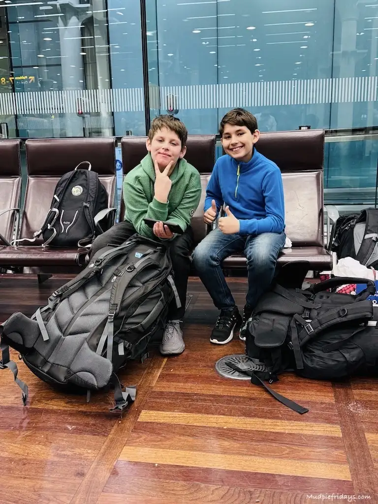 The boys sitting in the terminal at St Pancras once we had gone through security