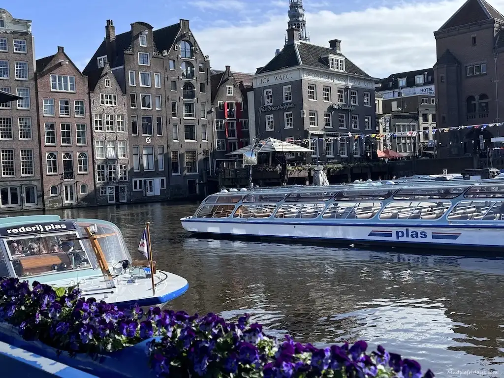 Boats on the Amsterdam canals and pretty spring flowers