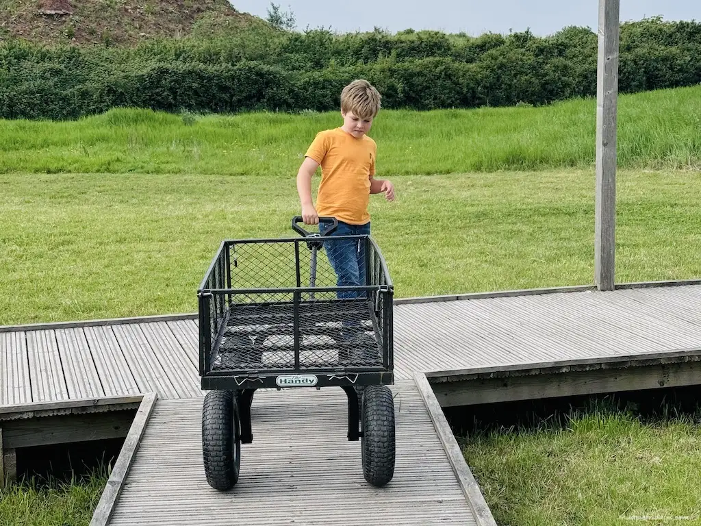 Harry pulling the trolly which you can use to take things from your car to the tent at The Wave Camp
