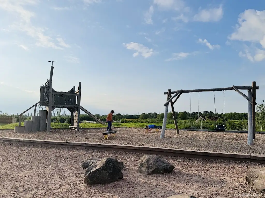 Harry playing on the balancing beams with the sun going down