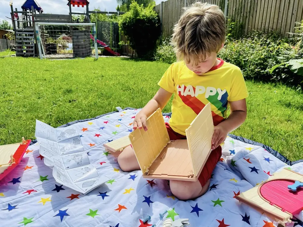 Harry building the little dog house for his new puppy pet