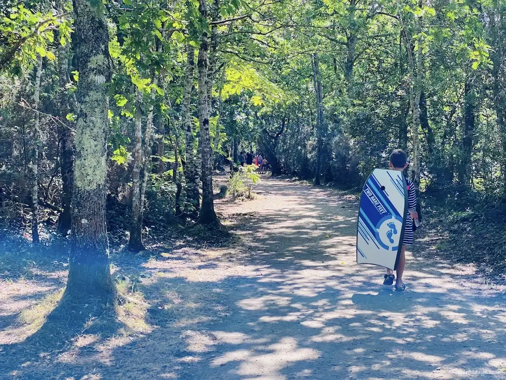 Walking to the beach with his body board