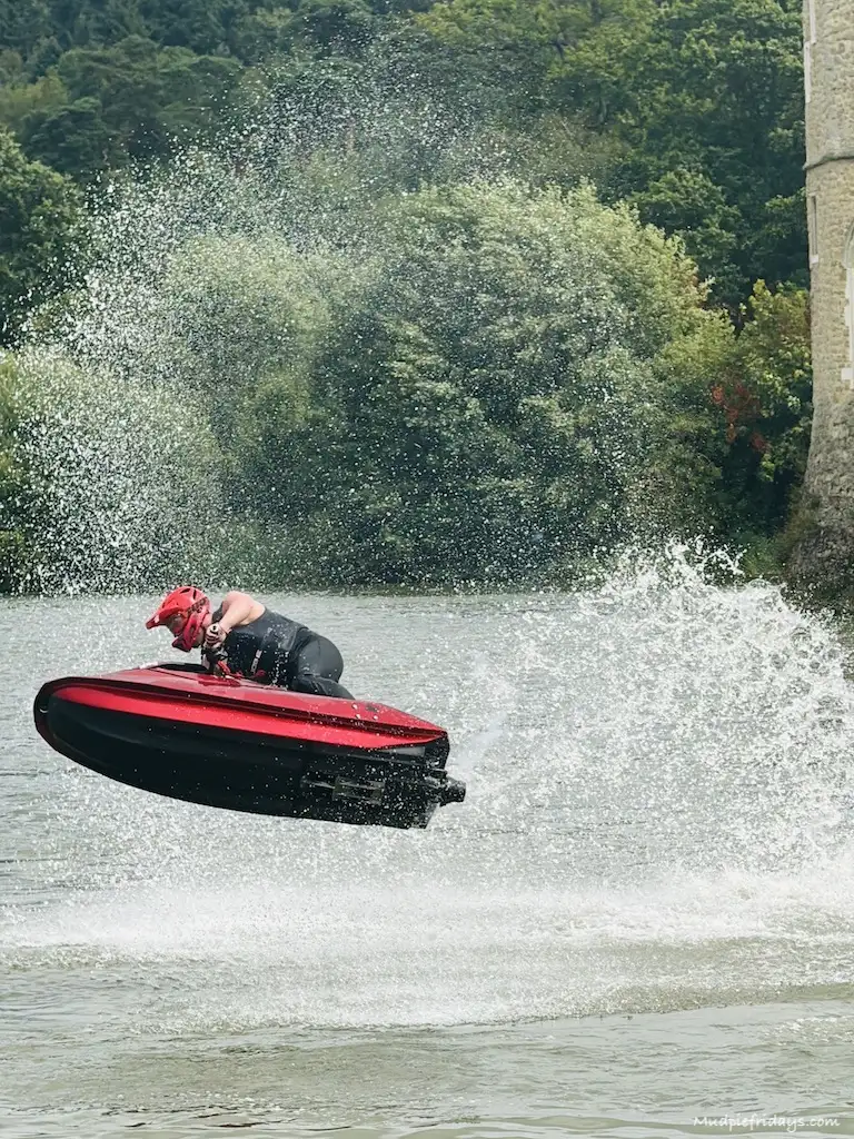 'DJR' Freestyle Jet Ski Team doing flips with Leeds Castle in the background