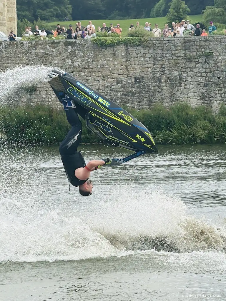 'DJR' Freestyle Jet Ski Team doing flips with Leeds Castle in the background