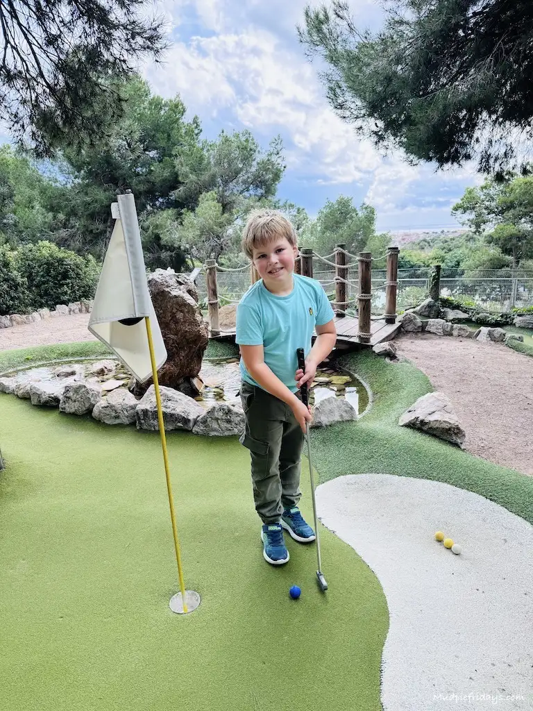 Harry playing mini golf at Vilanova Park in Spain