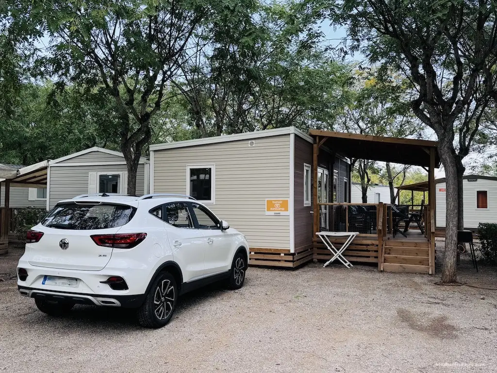 The parking area outside our premium mobile home staying at Vilanova Park with Eurocamp